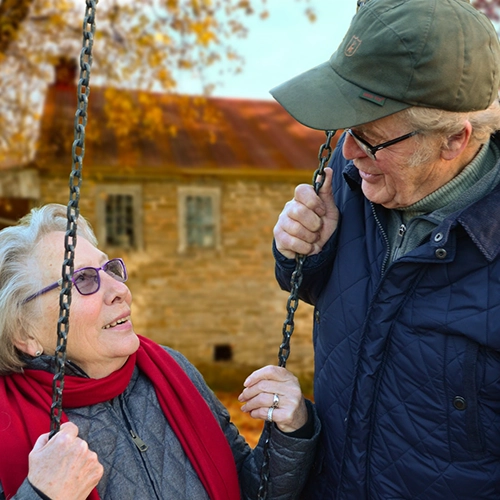 Elderly Couple on Swing