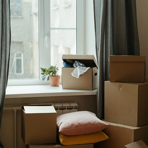 Photo of Packing Boxes on Window